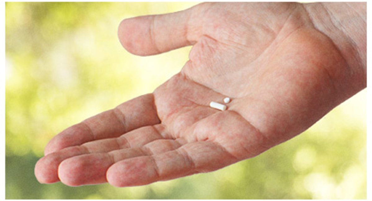 A man holding a hormone replacement therapy pellet in El Paso.